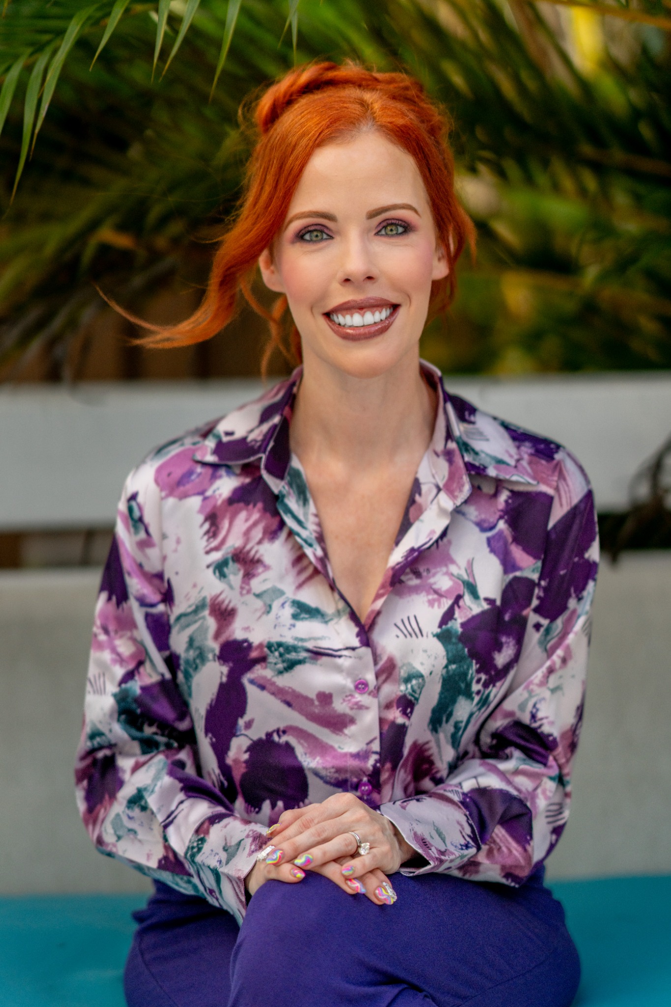 Dr. Laura Purdy in the purple outfit from her current brand shoot